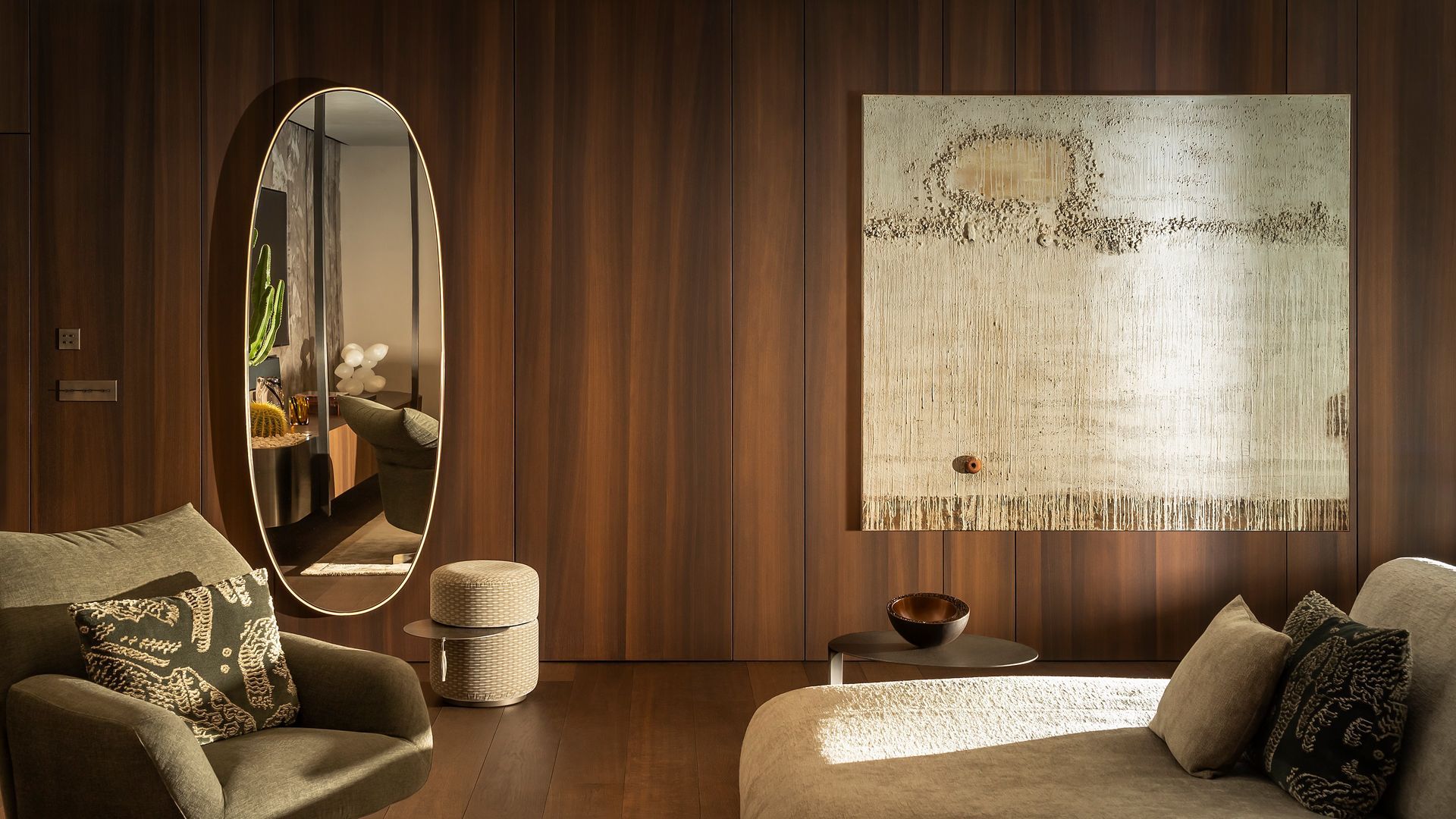 Bedroom with wooden walls. Tapiz on the wall, armchair and mirror