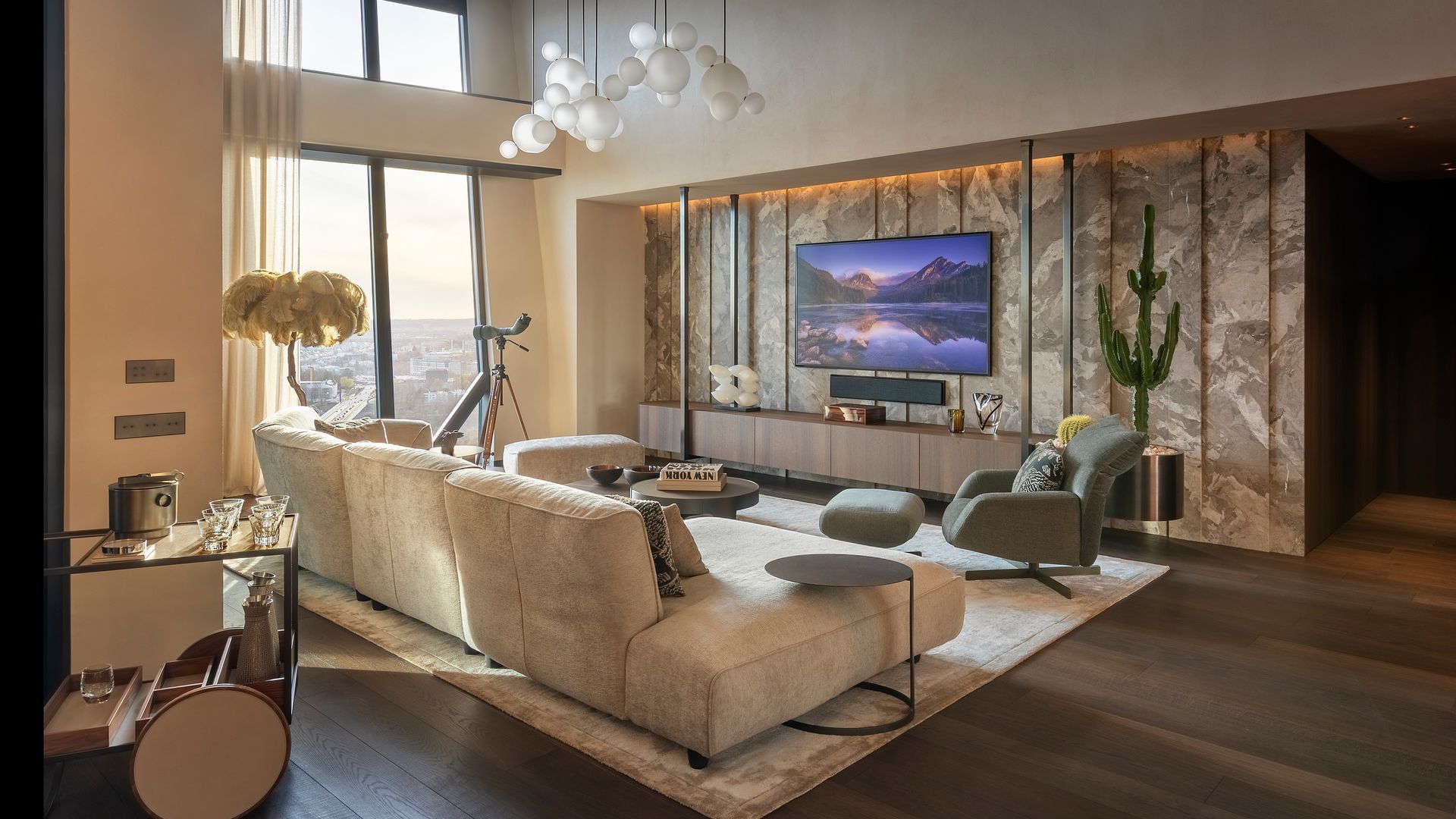Living room with stone walls, wooden floor, white sofa, carpet, ceiling lamps, window