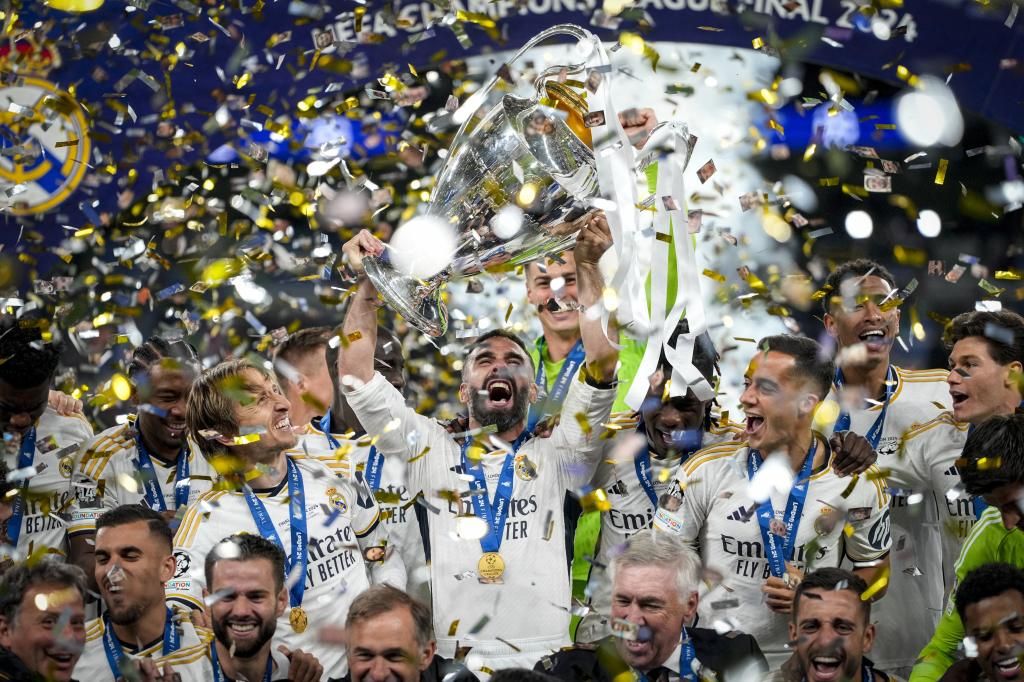 Real Madrid players celebrate with the Champions League trophy in the final played against Bodrtmund, June 1, 2024. (AP Photo/Kirsty Wigglesworth)