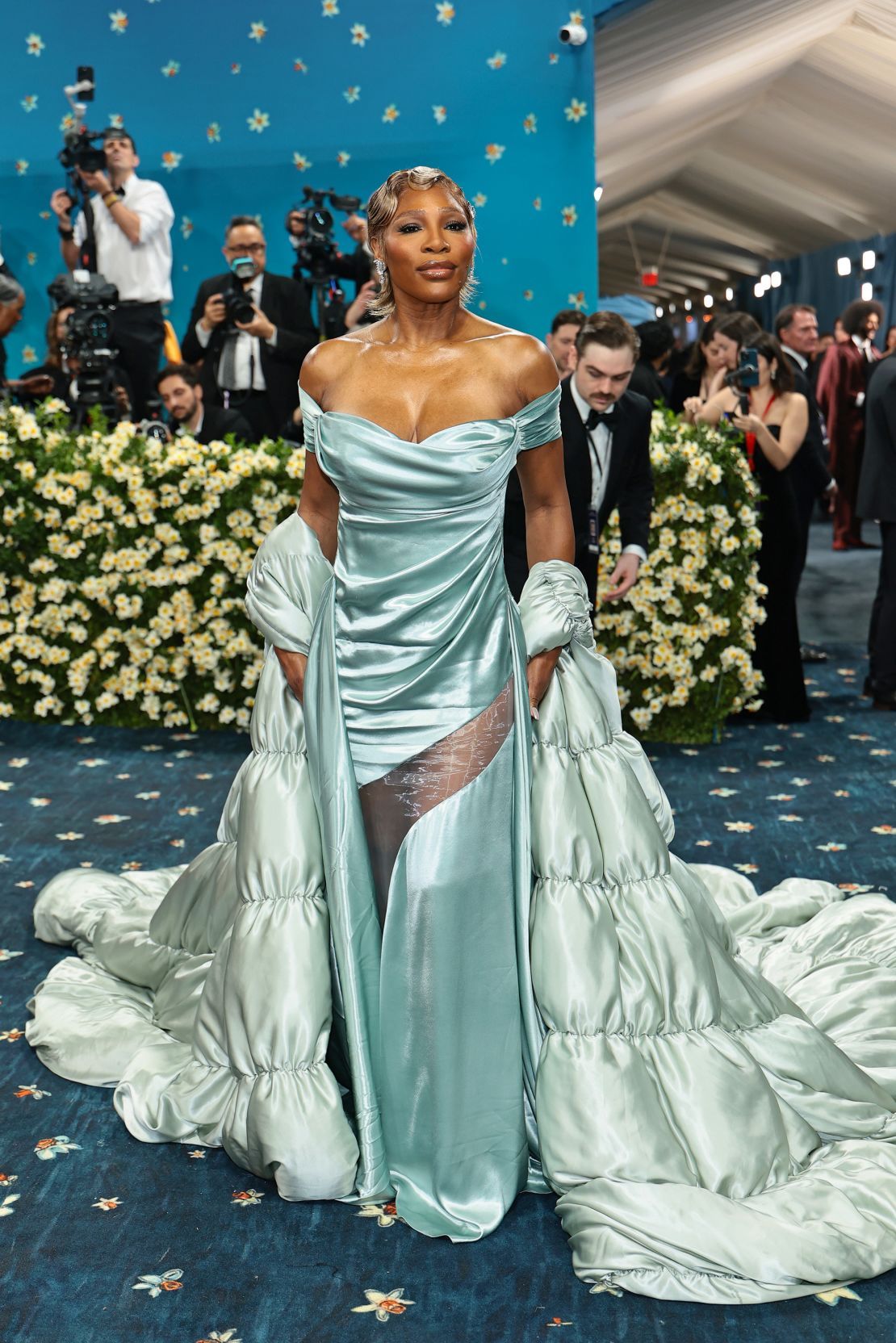Serena Williams modernized old Hollywood glam with an ice blue Bardot-style Moncler gown, oversized coat and golden finger waves.