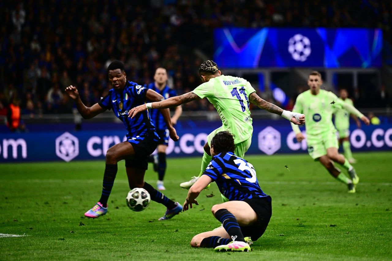 Brazilian striker #11 of Barcelona, Raphinha, scores his team's third goal during the second leg of the UEFA Champions League semifinal.