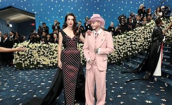 J Balvin accompanied by his