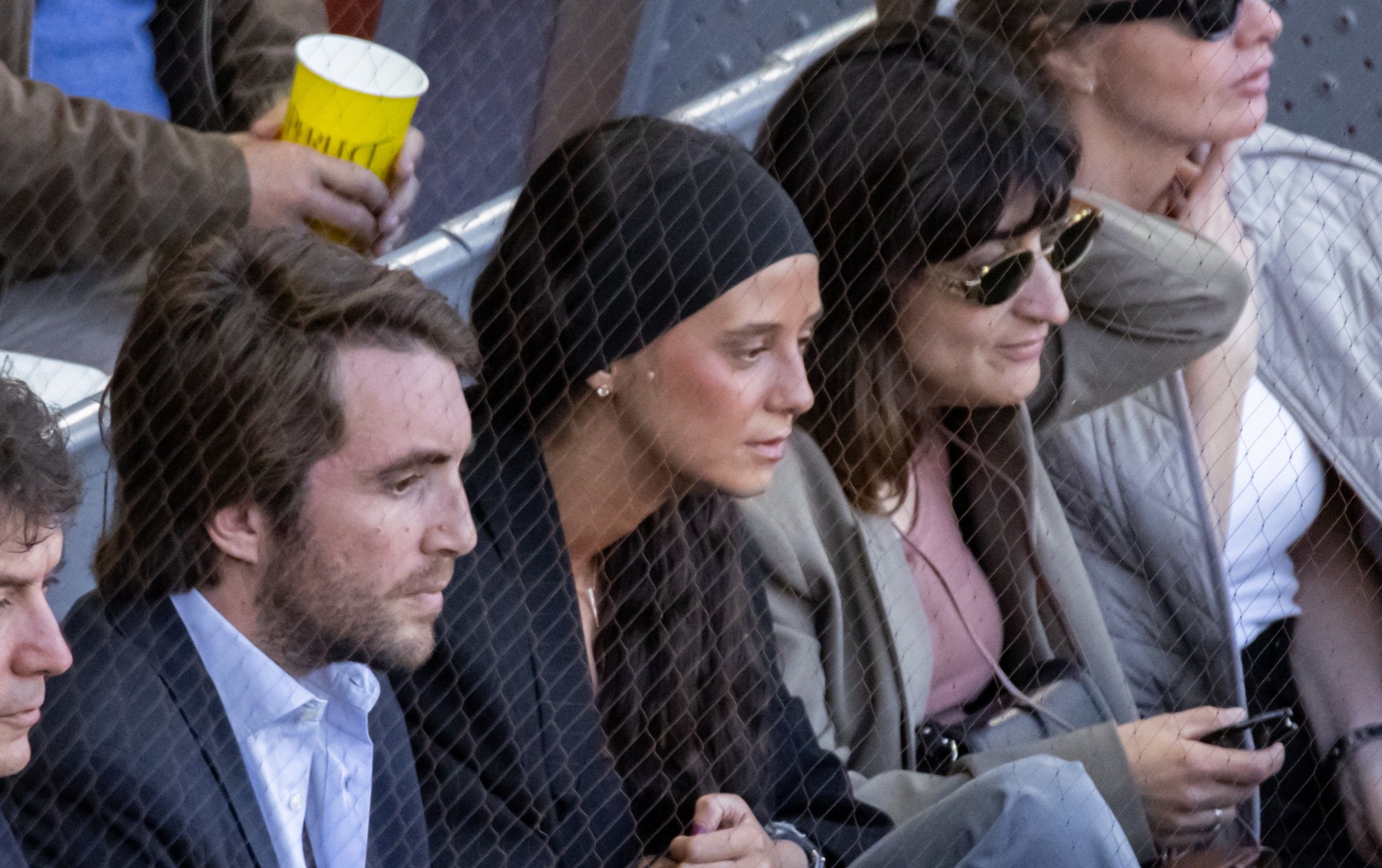 Victoria Federica de Marichalar and Bourbon, next to her partner, Borja Moreno Oriol (left) at the Mutua Madrid Open.