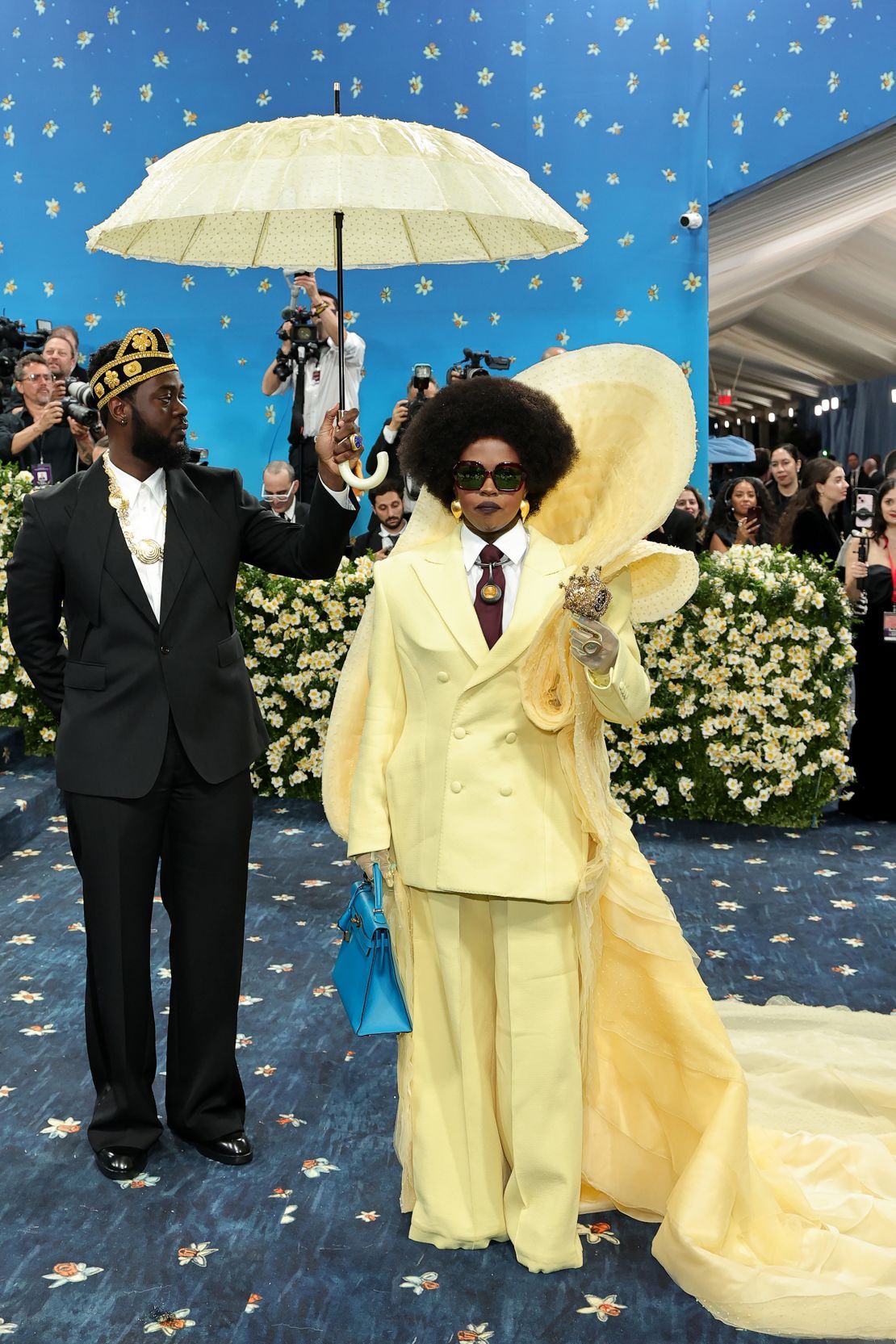 Lauryn Hill made her first Met Gala appearance in a sculptural pale-yellow suit and matching train. Her jewelry, created by jeweler and curator Emefa Cole, paid homage to Ghanaian royalty.