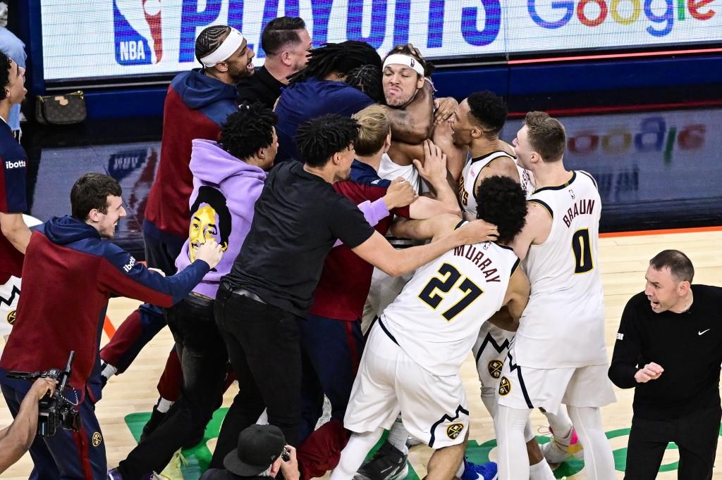 Aaron Gordon is congratulated by his teammates after scoring the triple of triumph.