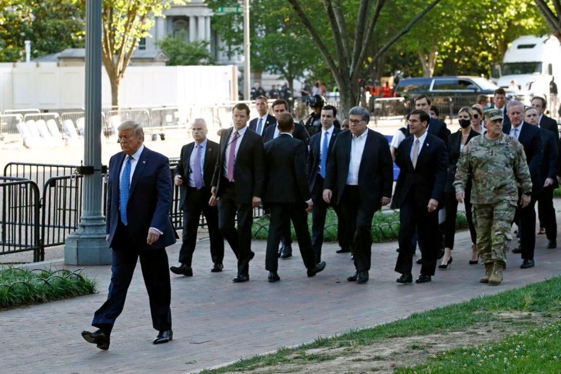 In this archive photo of June 1, 2020, President Donald Trump walks through Lafayette Park to visit the Church of San Juan in front of the White House in Washington.
