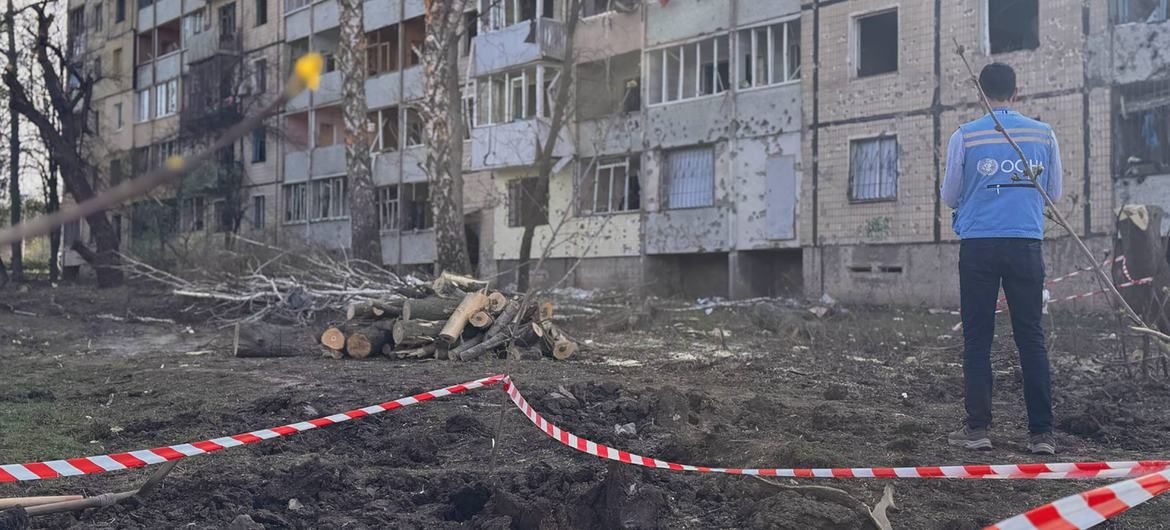 A humanitarian worker inspects a destroyed building in Ukraine (file). A humanitarian worker inspects a destroyed building in Ukraine (file).