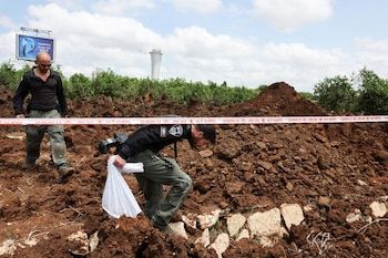Israeli police officers investigate
