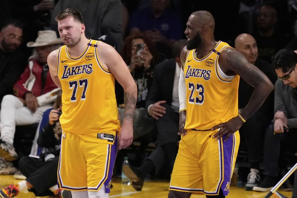 Luka Donc hurts the back in the presence of LeBron James during the fifth game of the series against Minnesota Timberwolves