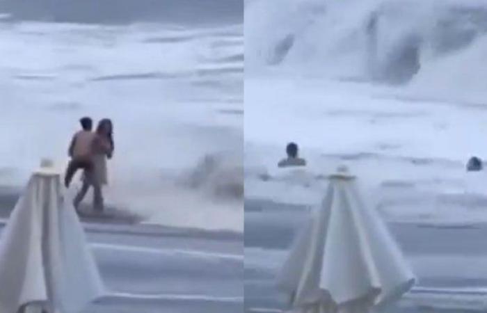 A woman was with her partner on the beach, she was swept away by a wave and disappeared