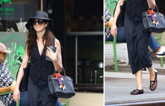 How to wear fishnet ballet flats, black satin skirt and suit vest like Anne Hathaway in June 2024
