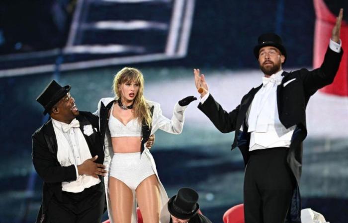 Taylor Swift brings Travis Kelce on stage and the audience goes crazy