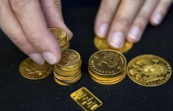 Gold prices edge down slightly as focus turns to US inflation data