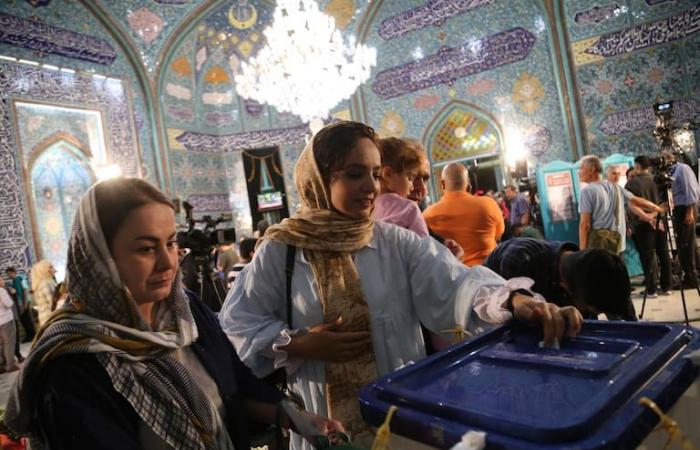 With record turnout, no candidate won a majority and there will be a runoff in Iran