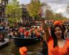 Dutch celebrate King’s Day with canal rides and orange-frosted cakes