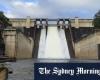 Warragamba Dam spills over as flash flooding warning issued