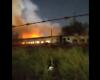 Disused carriages set on fire in a train depot