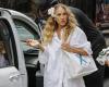 Sarah Jessica Parker sports a flower in her hair and an oversized white blouse after a day of filming the third season of And Simply Like That in New York.